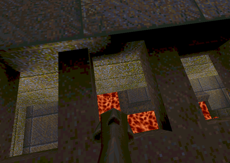 Lava glowing through openings in a grimy stone wall in Quake